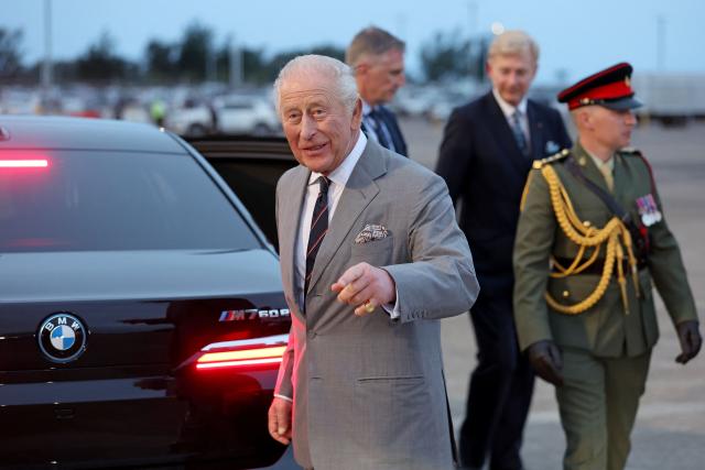 Britain's King Charles III gestures as he arrives to the L.F. Wade International Airport in Hamilton, Bermuda, on April 30, 2026. King Charles III is in Bermuda for his first visit to a British Overseas Territory as Sovereign. (Photo by Chris Jackson / POOL / AFP)