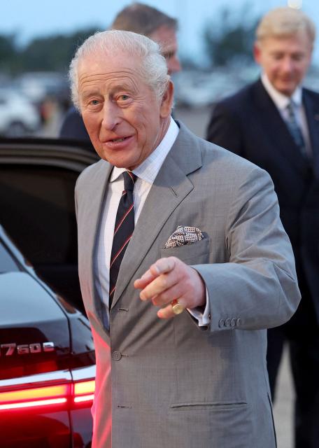 Britain's King Charles III gestures as he arrives to the L.F. Wade International Airport in Hamilton, Bermuda, on April 30, 2026. King Charles III is in Bermuda for his first visit to a British Overseas Territory as Sovereign. (Photo by Chris Jackson / POOL / AFP)