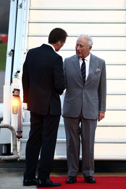 Britain's King Charles III is welcomed upon his arrival to the L.F. Wade International Airport in Hamilton, Bermuda, on April 30, 2026. King Charles III is in Bermuda for his first visit to a British Overseas Territory as Sovereign. (Photo by Henry NICHOLLS / AFP)
