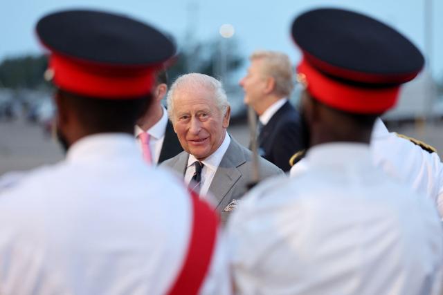 Britain's King Charles III is greeted by the Royal Bermuda Regiment on arrival at L.F. Wade International Airport in Hamilton, Bermuda, on April 30, 2026. King Charles III is in Bermuda for his first visit to a British Overseas Territory as Sovereign. (Photo by Chris Jackson / POOL / AFP)