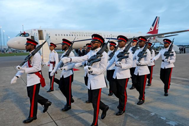 Members of the Royal Bermuda Regiment march in formation on the arrival of Britain's King Charles III at L.F. Wade International Airport in Hamilton, Bermuda, on April 30, 2026. King Charles III is in Bermuda for his first visit to a British Overseas Territory as Sovereign. (Photo by Chris Jackson / POOL / AFP)