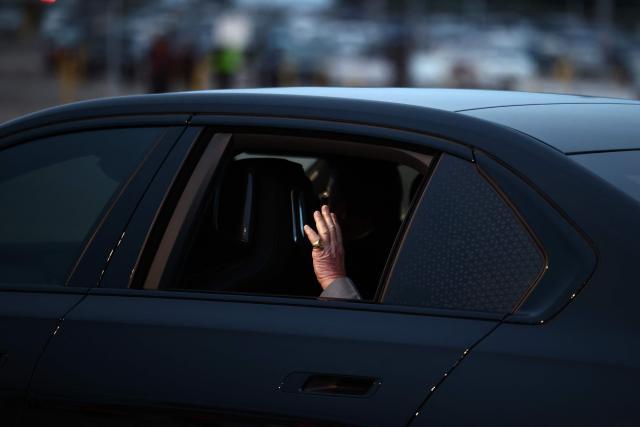 Britain's King Charles III waves from his vehicle after arriving to the L.F. Wade International Airport in Hamilton, Bermuda, on April 30, 2026. King Charles III is in Bermuda for his first visit to a British Overseas Territory as Sovereign. (Photo by Henry NICHOLLS / AFP)
