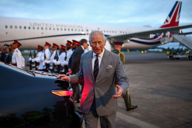 Britain's King Charles III walks toward his vehicle after arriving to the L.F. Wade International Airport in Hamilton, Bermuda, on April 30, 2026. King Charles III is in Bermuda for his first visit to a British Overseas Territory as Sovereign. (Photo by HENRY NICHOLLS / AFP)