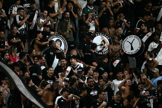 Fans of Vasco da Gama celebrate at the end of the Copa Sudamericana group stage football match between Brazil's Vasco da Gama and Paraguay's Olimpia at the Sao Januario stadium in Rio de Janeiro, Brazil on April 30, 2026. (Photo by MAURO PIMENTEL / AFP)
