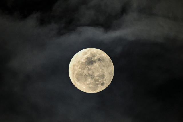 The 99.4% waxing gibbous moon is seen over Panama Bay in Panama City on April 30, 2026 (Photo by MARTIN BERNETTI / AFP)