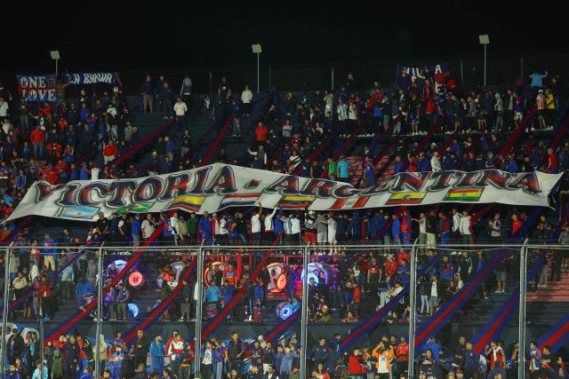 Fans of Tigre cheer for their team ahead of the Copa Sudamericana group stage football match between Argentina's Tigre and Colombia's America de Cali at the Jose Dellagiovanna stadium in Victoria, Buenos Aires province, Argentina on April 30, 2026. (Photo by Alejandro PAGNI / AFP)