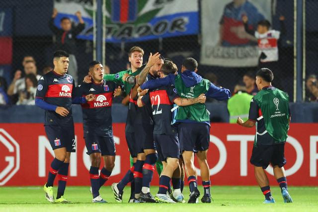 Tigre's forward #08 Martin Garay (unseen) celebrates with teammates after scoring his team's first goal during the Copa Sudamericana group stage football match between Argentina's Tigre and Colombia's America de Cali at the Jose Dellagiovanna stadium in Victoria, Buenos Aires province, Argentina on April 30, 2026. (Photo by Alejandro PAGNI / AFP)