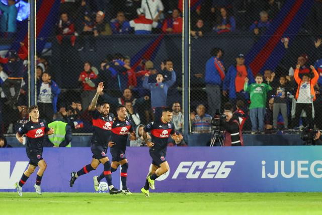 Tigre's forward #08 Martin Garay (C-R) celebrates with teammates after scoring his team's first goal during the Copa Sudamericana group stage football match between Argentina's Tigre and Colombia's America de Cali at the Jose Dellagiovanna stadium in Victoria, Buenos Aires province, Argentina on April 30, 2026. (Photo by Alejandro PAGNI / AFP)