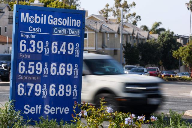 A vehicle drives past a Mobil gas station in Redondo Beach, California on April 30, 2026 where prices listed show over $6 per gallon. Energy costs have surged since the near-total closure of the Strait of Hormuz, through which about a fifth of the world's oil and gas usually passes, following the outbreak of the US-Israeli war against Iran. (Photo by Patrick T. Fallon / AFP)