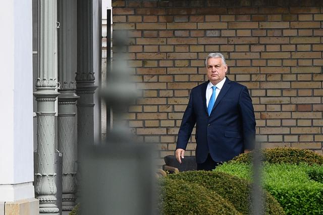 (FILES) Outgoing Hungarian Prime Minister Viktor Orban arrives at the Presidential Sandor Palace in Budapest on April 15, 2026 to meet with Hungary's President, three days after general elections in Hungary. Last month's crushing election defeat of nationalist Viktor Orban has thrown his political future into doubt and shattered his reputation as Hungary's all-powerful leader built up over 16 years. While senior members of his Fidesz party seem to have closed ranks behind him for now, some rare public dissent from within the party has seeped out, and analysts say it will be difficult to recover from the steep loss in the vote that saw a record turnout. (Photo by Ferenc ISZA / AFP)