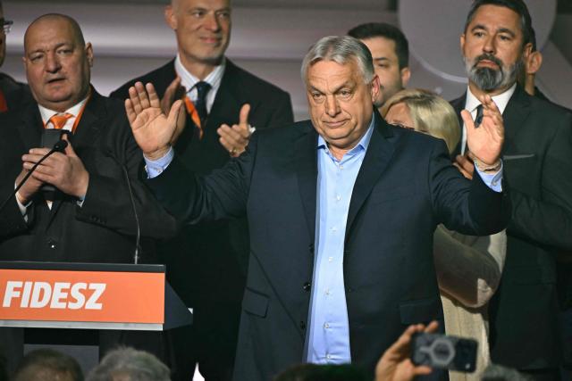 (FILES) Hungary's Prime Minister Viktor Orban greets supporters at the Balna centre in Budapest during a general election in Hungary, on April 12, 2026. Last month's crushing election defeat of nationalist Viktor Orban has thrown his political future into doubt and shattered his reputation as Hungary's all-powerful leader built up over 16 years. While senior members of his Fidesz party seem to have closed ranks behind him for now, some rare public dissent from within the party has seeped out, and analysts say it will be difficult to recover from the steep loss in the vote that saw a record turnout. (Photo by Attila KISBENEDEK / AFP)