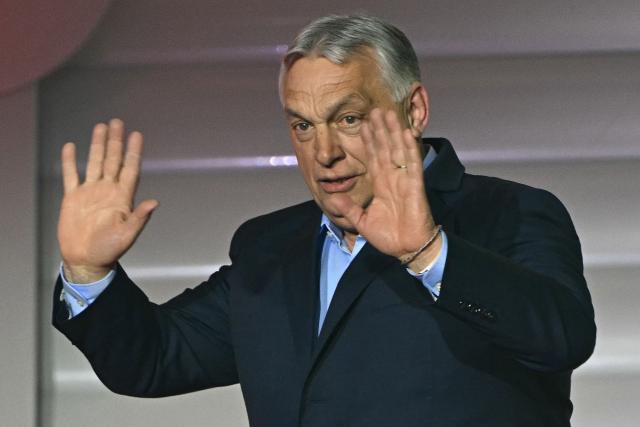 (FILES) Hungary's Prime Minister Viktor Orban waves to supporters at the Balna centre in Budapest during a general election in Hungary, on April 12, 2026. Last month's crushing election defeat of nationalist Viktor Orban has thrown his political future into doubt and shattered his reputation as Hungary's all-powerful leader built up over 16 years. While senior members of his Fidesz party seem to have closed ranks behind him for now, some rare public dissent from within the party has seeped out, and analysts say it will be difficult to recover from the steep loss in the vote that saw a record turnout. (Photo by Attila KISBENEDEK / AFP) / ALTERNATIVE CROP