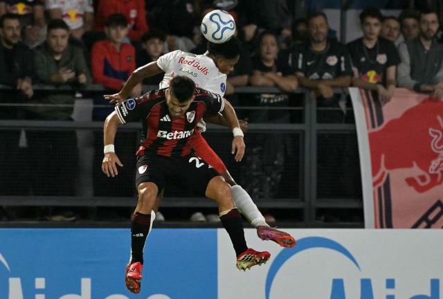 River Plate's defender #21 Marcos Acuna (front) and Red Bull Bragantino's defender #04 Alix Vinicius jump to head the ball during the Copa Sudamericana group stage football match between Brazil's Red Bull Bragantino and Argentina's River Plate at the Municipal Cicero de Souza Marques stadium in Braganca Paulista, state of Sao Paulo, Brazil on April 30, 2026. (Photo by NELSON ALMEIDA / AFP)