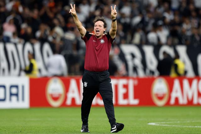 Corinthians' head coach Fernando Diniz celebrates at the end of the Copa Libertadores group stage football match between Brazil's Corinthians and Uruguay's Penarol at the Neo Quimica Arena stadium in Sao Paulo, Brazil on April 30, 2026. (Photo by Miguel SCHINCARIOL / AFP)
