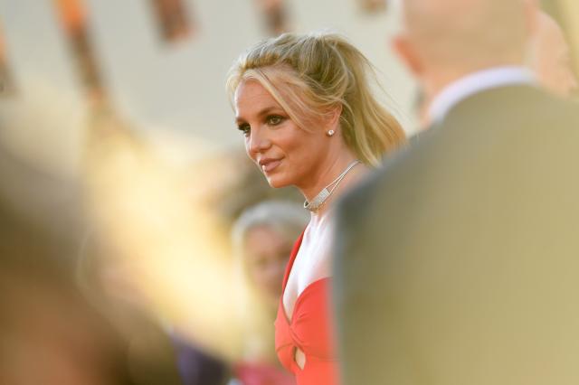 (FILES) US singer Britney Spears arrives for the premiere of Sony Pictures' "Once Upon a Time... in Hollywood" at the TCL Chinese Theatre in Hollywood, California on July 22, 2019. Pop star Britney Spears on April 30 was charged with driving under the influence of alcohol and drugs, prosecutors outside Los Angeles said -- but she could avoid jail time with a plea deal. The criminal complaint does not specify which substance the 44-year-old singer was allegedly using when she was arrested in early March. Spears is scheduled to be arraigned on Monday in a courtroom in Ventura County, which borders Los Angeles County. (Photo by VALERIE MACON / AFP)