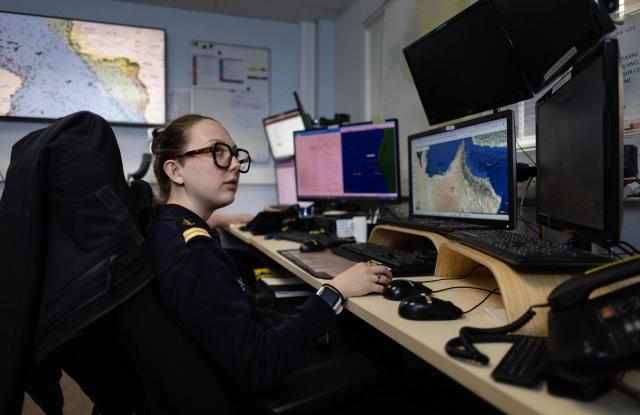 A worker of the Maritime International Cooperation and Awareness (MICA) center looks at screens at the MICA in Brest, western France on April 27, 2026. Attacks on oil tankers in the Strait of Hormuz, piracy off the coast of Somalia, drug trafficking: with their eyes fixed on screens crammed with maps, a dozen sailors at the MICA Centre monitor the worlds maritime hotspots in real time.
Since the start of the war in the Middle East, triggered by Israeli-American strikes on Iran on February 28, 2026, this French centre of expertise in maritime security, attached to the French Navy, has been providing invaluable support to civilian vessels and crews stranded in the Persian Gulf. (Photo by Fred TANNEAU / AFP)