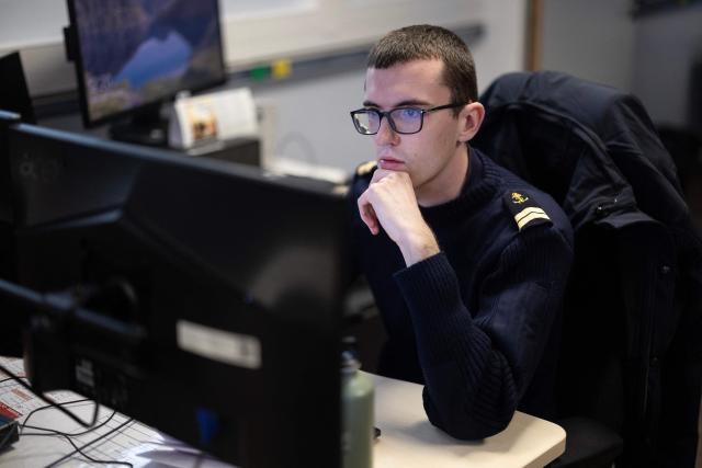A worker of the Maritime International Cooperation and Awareness (MICA) center looks at screens at the MICA in Brest, western France on April 27, 2026. Attacks on oil tankers in the Strait of Hormuz, piracy off the coast of Somalia, drug trafficking: with their eyes fixed on screens crammed with maps, a dozen sailors at the MICA Centre monitor the worlds maritime hotspots in real time.
Since the start of the war in the Middle East, triggered by Israeli-American strikes on Iran on February 28, 2026, this French centre of expertise in maritime security, attached to the French Navy, has been providing invaluable support to civilian vessels and crews stranded in the Persian Gulf. (Photo by Fred TANNEAU / AFP)