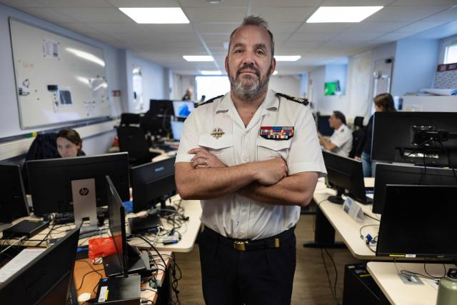 French Commandant Thomas Scalabre poses at the MICA center (Maritime Information and Cooperation and Awareness) in Brest, western France on April 27, 2026. Attacks on oil tankers in the Strait of Hormuz, piracy off the coast of Somalia, drug trafficking: with their eyes fixed on screens crammed with maps, a dozen sailors at the MICA Centre monitor the worlds maritime hotspots in real time.
Since the start of the war in the Middle East, triggered by Israeli-American strikes on Iran on February 28, 2026, this French centre of expertise in maritime security, attached to the French Navy, has been providing invaluable support to civilian vessels and crews stranded in the Persian Gulf. (Photo by Fred TANNEAU / AFP)