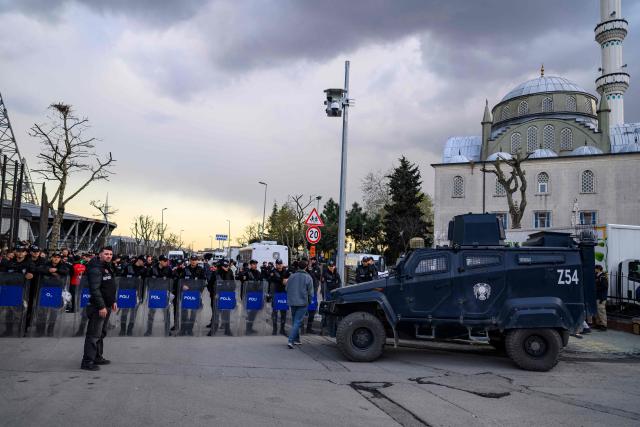 Turkish riot police stand outside the Esenler Erokspor Stadium ahead of the Trendyol League football match between Amedspor and Esenler Erokspor in the Esenler district of Istanbul, on April 9, 2026. Amedspor, a club from Diyarbakir, the "capital" of Turkey's predominantly Kurdish southeast, can secure promotion to the first division on May 2, 2026, an unprecedented prospect that has sparked a wave of enthusiasm among the country's millions of Kurds. (Photo by Yasin AKGUL / AFP)