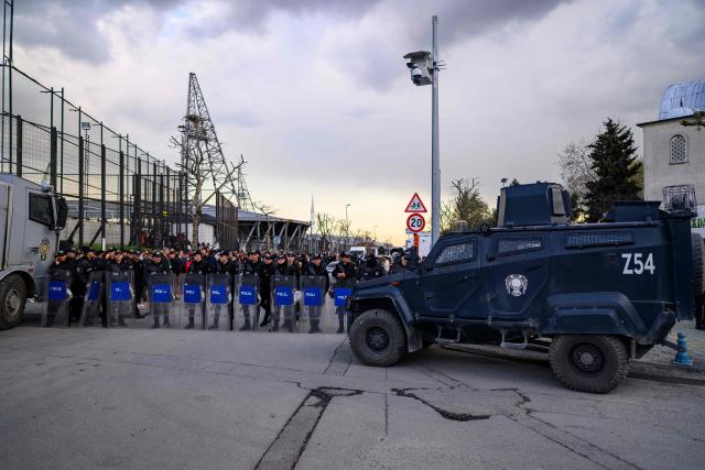 Turkish riot police stand outside the Esenler Erokspor Stadium ahead of the Trendyol League football match between Amedspor and Esenler Erokspor in the Esenler district of Istanbul, on April 9, 2026. Amedspor, a club from Diyarbakir, the "capital" of Turkey's predominantly Kurdish southeast, can secure promotion to the first division on May 2, 2026, an unprecedented prospect that has sparked a wave of enthusiasm among the country's millions of Kurds. (Photo by Yasin AKGUL / AFP)