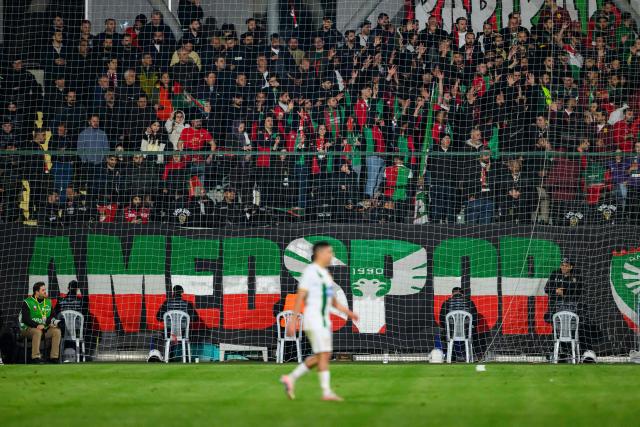 Amedspor's supporters cheer their team on from the stands during the Trendyol League football match between Amedspor and Esenler Erokspor at the Esenler Erokspor Stadium, in the Esenler district of Istanbul, on April 9, 2026. Amedspor, a club from Diyarbakir, the "capital" of Turkey's predominantly Kurdish southeast, can secure promotion to the first division on May 2, 2026, an unprecedented prospect that has sparked a wave of enthusiasm among the country's millions of Kurds. (Photo by Yasin AKGUL / AFP)