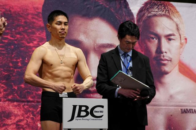 Japanese boxer Kazuto Ioka (L) poses for photographs during a weigh-in ahead of his May 2 boxing match with Takuma Inoue in Tokyo on May 1, 2026. (Photo by Yuichi YAMAZAKI / AFP)