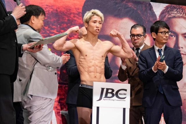 Japanese boxer Naoya Inoue (C) poses for photographs during a weigh-in ahead of his May 2 boxing match with Junto Nakatani in Tokyo on May 1, 2026. (Photo by Yuichi YAMAZAKI / AFP)