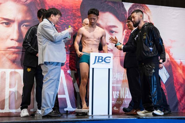 Japanese boxer Takuma Inoue (C) is seen during a weigh-in ahead of his May 2 boxing match with Kazuto Ioka in Tokyo on May 1, 2026. (Photo by Yuichi YAMAZAKI / AFP)