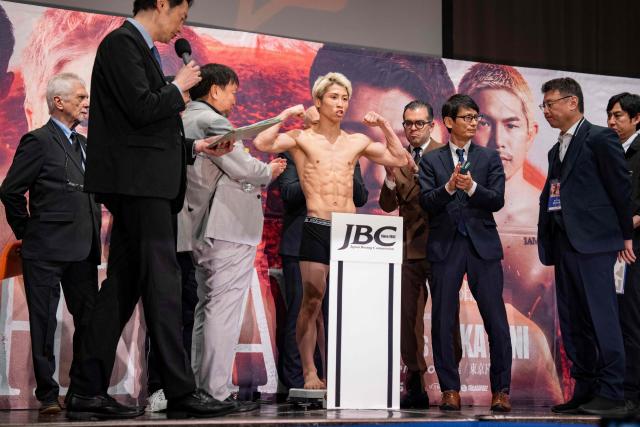 Japanese boxer Naoya Inoue (C) poses for photographs during a weigh-in ahead of his May 2 boxing match with Junto Nakatani in Tokyo on May 1, 2026. (Photo by Yuichi YAMAZAKI / AFP)