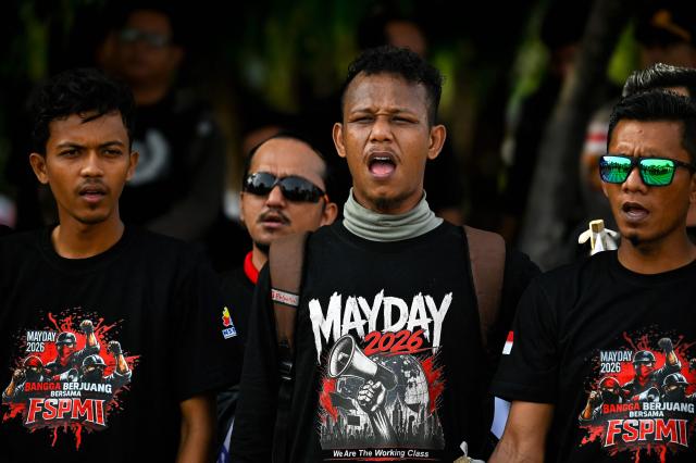 Workers participate in a rally to mark International Labour Day in Banda Aceh on May 1, 2026. (Photo by CHAIDEER MAHYUDDIN / AFP)