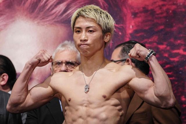 Japanese boxer Naoya Inoue (C) poses for photographs during a weigh-in ahead of his May 2 boxing match with Junto Nakatani in Tokyo on May 1, 2026. (Photo by Yuichi YAMAZAKI / AFP)