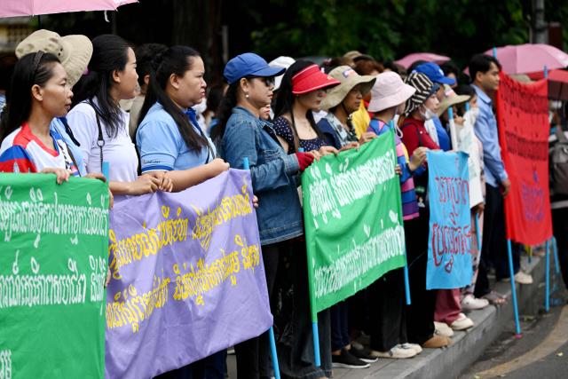 Cambodian workers attend a protest to mark the International Labour Day in front of the French embassy in Phnom Penh on May 1, 2026. (Photo by TANG CHHIN Sothy / AFP)