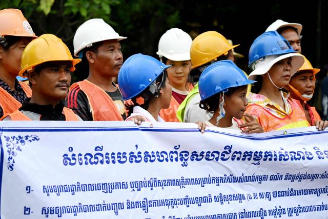 Cambodian workers attend a protest to mark the International Labour Day in front of the French embassy in Phnom Penh on May 1, 2026. (Photo by TANG CHHIN Sothy / AFP)
