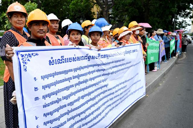 Cambodian workers attend a protest to mark the International Labour Day in front of the French embassy in Phnom Penh on May 1, 2026. (Photo by TANG CHHIN Sothy / AFP)