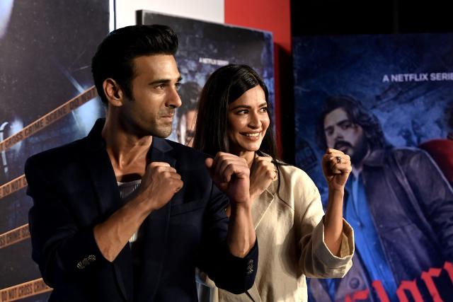 Bollywood actor Pulkit Samrat and actress Kriti Kharbanda pose for photographs during the screening of Netflix's thriller series Glory, in Mumbai on April 30, 2026. (Photo by SUJIT JAISWAL / AFP)