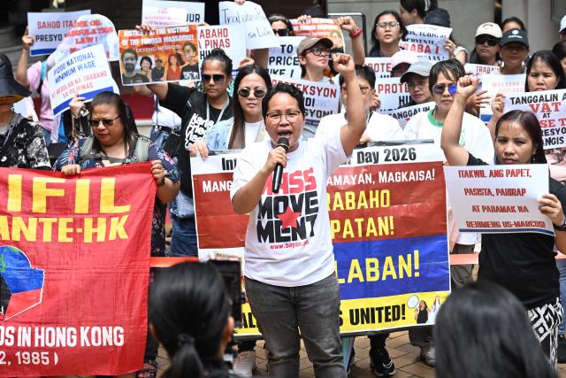 Members of the Asian Migrants' Coordinating Body (AMCB), the biggest coalition of migrant domestic workers' associations and unions of various nationalities, take part in a rally on Labour Day in Hong Kong on May 1, 2026. (Photo by Peter PARKS / AFP)