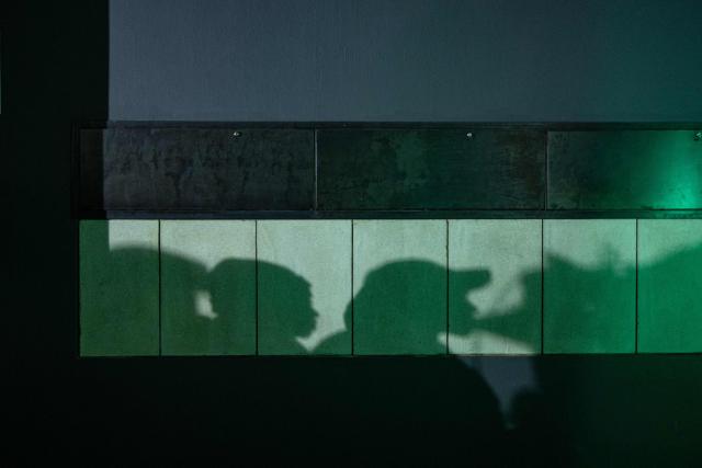Silhouettes of attendees cast against a wall as they gather at the launch of “Finishing What Was Started”, an event reflecting on the legacy of the June 1976 generation and a call to action for today’s youth, at the Hector Pieterson Museum in Soweto on April 30, 2026. (Photo by EMMANUEL CROSET / AFP)