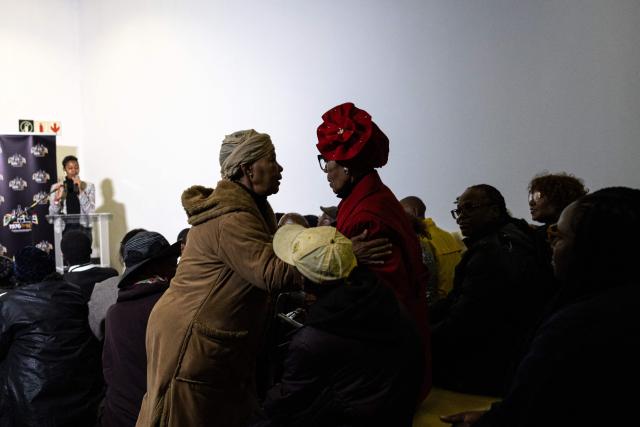 Antoinette Sithole (L), sister of Hector Pieterson, greets a fellow veteran of the June 16, 1976 Soweto Uprising, at the launch of “Finishing What Was Started”, an event reflecting on the legacy of the June 1976 generation and a call to action for today’s youth, at the Hector Pieterson Museum in Soweto on April 30, 2026. (Photo by EMMANUEL CROSET / AFP)