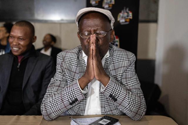Seth Mazibuko, a veteran of the June 16, 1976 Soweto Uprising, prays at the launch of “Finishing What Was Started”, an event reflecting on the legacy of the June 1976 generation and a call to action for today’s youth, at the Hector Pieterson Museum in Soweto on April 30, 2026. (Photo by EMMANUEL CROSET / AFP)