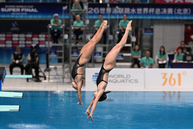 Australia's Maddison Keeney (R) and Alysha Koloi (L) compete in the women's 3m synchronised diving at the World Aquatics Diving World Cup Super Finals 2026 in Beijing on May 1, 2026. (Photo by ADEK BERRY / AFP)
