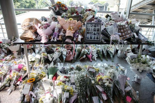 Offered flowers for the victims of a train collision that killed 16 people are seen at Bekasi Timur Station in Bekasi, West Java, on May 1, 2026. A long-distance train slammed into the last, women-only carriage of a stationary commuter train near the Bekasi Timur station late on April 27, prompting a nearly 12-hour rescue effort with crews prying open mangled carriages. (Photo by Aditya Irawan / AFP)