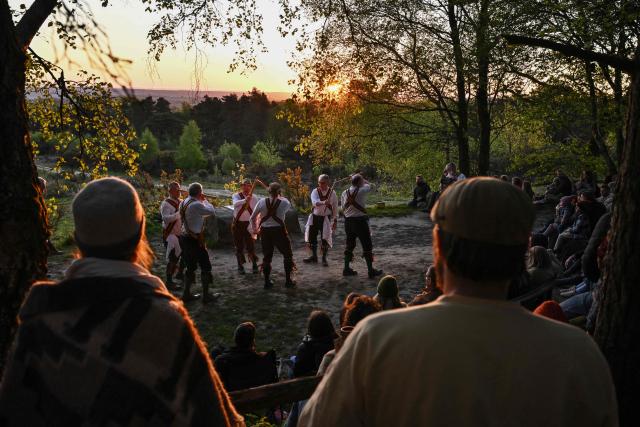The Ashdown Forest Morris Men perform at sunrise in the Ashdown Forest, south of London on May 1, 2026. Historically, in rural Britain, May Day celebrations were associated with the fertility of spring and the start of summer. (Photo by Ben STANSALL / AFP)