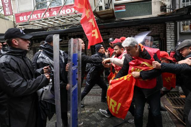 Turkish police scuffle with protestors during a May Day (Labour Day) rally, marking international Workers' Day, in Besiktas, a district of Istanbul, on May 1, 2026. (Photo by BERK OZKAN / AFP)