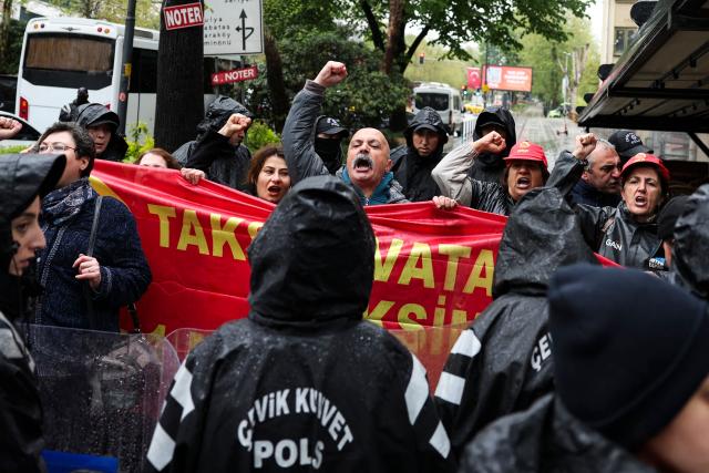 Protestors hold a banner as they shout slogans during a May Day (Labour Day) rally, marking international Workers' Day, in Besiktas, a district of Istanbul, on May 1, 2026. (Photo by BERK OZKAN / AFP)