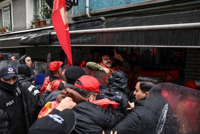 Turkish police scuffle with protestors during a May Day (Labour Day) rally, marking international Workers' Day, in Besiktas, a district of Istanbul, on May 1, 2026. (Photo by BERK OZKAN / AFP)