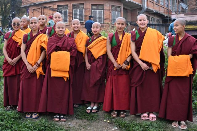 Novice Buddhist monks look on as they visit the Swayambhunath Stupa during Buddha Purnima commemorating Buddha's birthday, in Kathmandu on May 1, 2026. (Photo by PRAKASH MATHEMA / AFP)