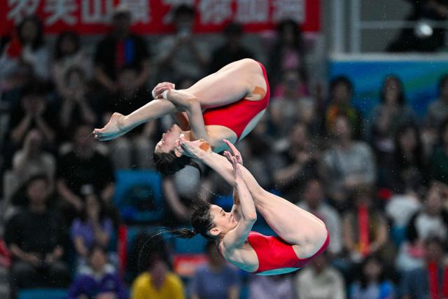 North Korea's Kim Mi-rae and Jo Jin-mi compete in women's 10m synchronised diving at the World Aquatics Diving World Cup Super Finals 2026 in Beijing on May 1, 2026. (Photo by ADEK BERRY / AFP)
