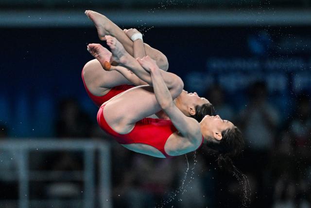 North Korea's Kim Mi-rae and Jo Jin-mi compete in women's 10m synchronised diving at the World Aquatics Diving World Cup Super Finals 2026 in Beijing on May 1, 2026. (Photo by ADEK BERRY / AFP)