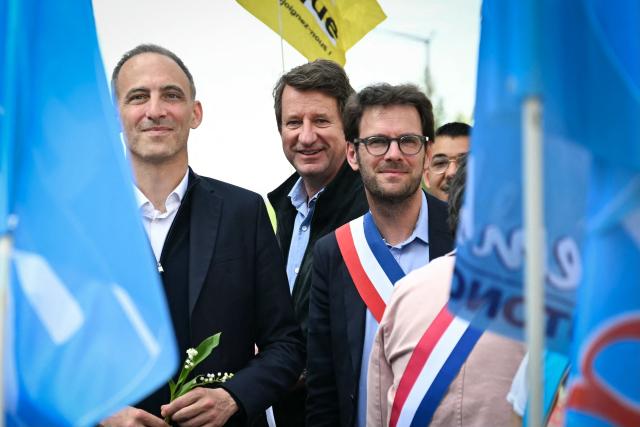Place publique's centre-left party leader and France's MEP Raphael Glucksmann (L), flanked by Mayor of Rouen Nicolas Mayer-Rossignol (R) and Yannick Jadot (C), march as they take part in a May Day (Labour Day) rally, marking International Workers' Day, in Rouen, northern France on May 1, 2026 (Photo by Lou BENOIST / AFP)