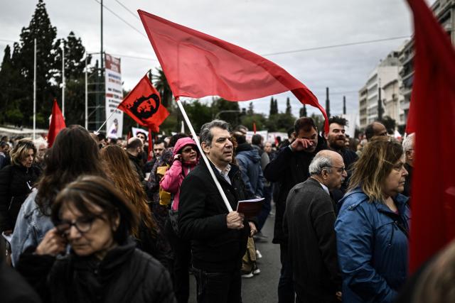 Demonstrators take part in a May Day (Labour Day) rally, marking international Workers' Day, in Athens on May 1, 2026. (Photo by Aris MESSINIS / AFP)